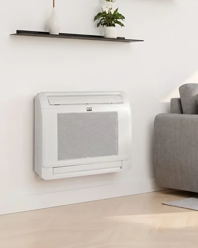 Family relaxing on the sofa next to a white Remko wall heater in the living room.