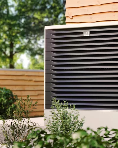 Remko heat pump outdoors in front of wooden cladding