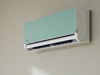 Klimawandgerät mit mintgrüner Blende an Wand